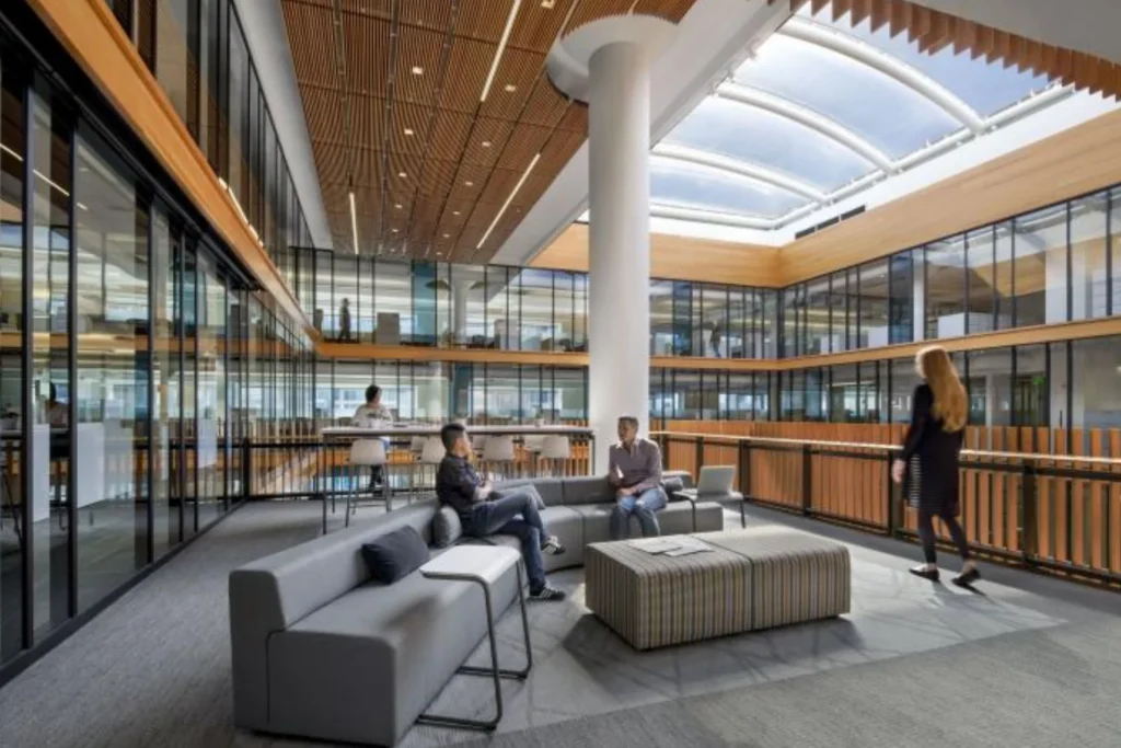 Bright atrium in a new office building, highlighting sustainable architecture and a focus on environmental responsibility