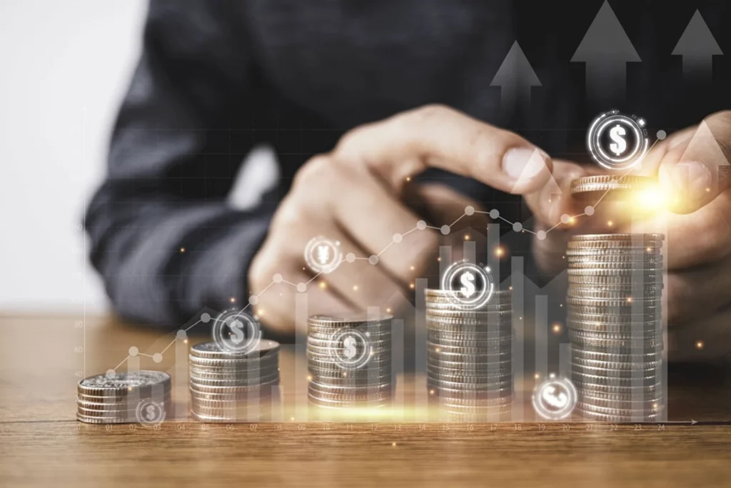 Businessman displays coins and cash on a wooden table, with digital currency icons, related to the Core Investment Challenge