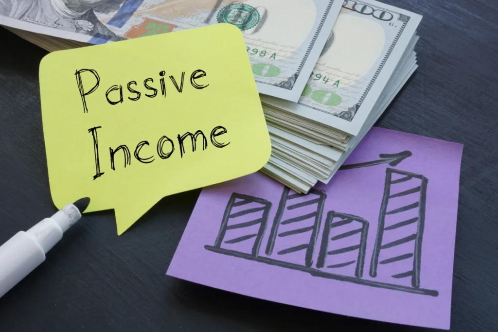 Concept of passive income featuring money and graph paper, highlighting investing as the top approach for generating income